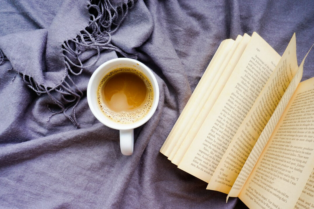 Reading the morning paper at a cafe